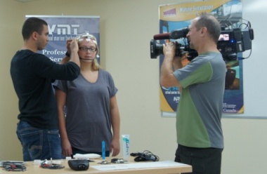 The Discovery Channel�s Daily Planet program visited Memorial University�s St. John�s campus recently. Crew members from the show were here to get some footage regarding a partnership between Drs. Scott MacKinnon, School of Human Kinetics and Recreation, and Brian Veitch, Faculty of Engineering and Applied Science, and Virtual Marine Technology, a small water craft simulation company. The partnership involves investigating physiological responses to simulated evacuation scenarios on offshore oil structures. The project is funded by the Atlantic Canada Opportunities Agency through the Atlantic Innovation Fund. The researchers are hoping the results will help offshore safety officials train for mustering and evacuation situations. Here, research subject Christie Noftall (centre) is hooked up to an electroencephalography (EEG) monitor by David Bradbury-Squires (left), a graduate student and project team member at the School of Human Kinetics and Recreation. Daily Planet cameraman Barry Springgay recorded the action. 

