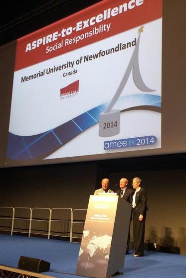 Dean Rourke accepting the ASPIRE award at the AMEE conference